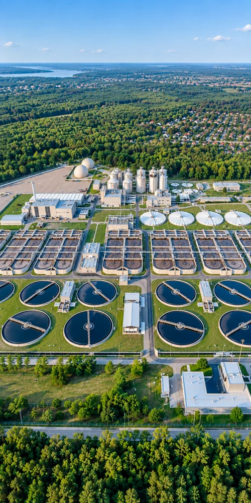 Municipal wastewater treatment facility surrounded by green countryside